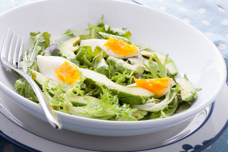 Close up of avocado salad with boiled eggsの写真素材