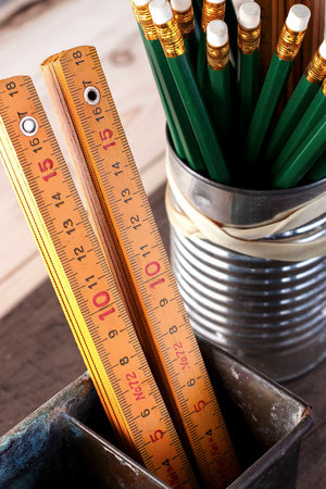 Vintage yellow folding ruler in the old box の写真素材