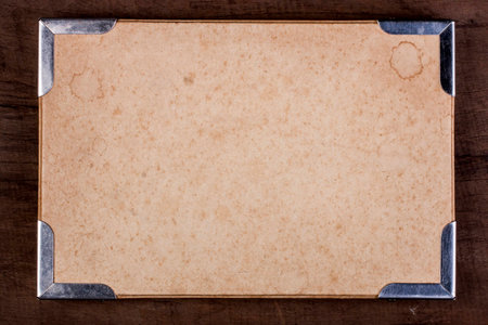 Paper box frame with metal corner on wooden table の写真素材