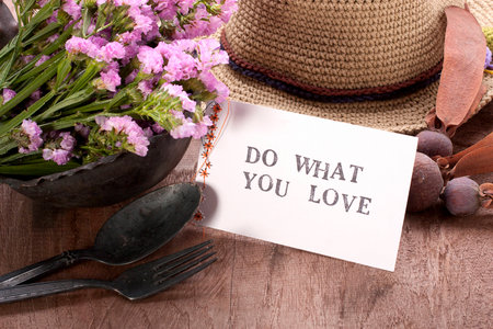 Card message on a wooden table in a rustic atmosphere.の写真素材