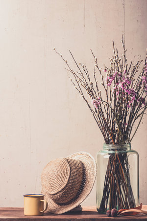 Dry flowers and hat with retro coffee cup.(vintage mood)の写真素材