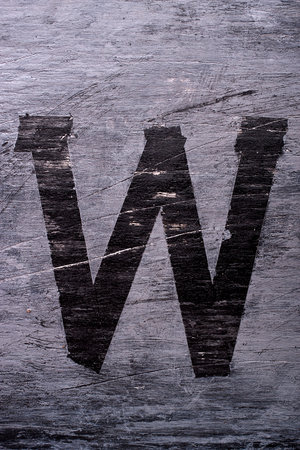 Black grunge alphabet sticky tape effect.Letter Wの写真素材