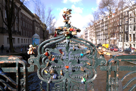 Amsterdam,The Netherlands-march 1,2015: Lock at the bridge, key in the water: love bridge in...