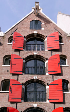 Amsterdam ,Netherlands-april 12, 2015: Window shutters at a amsterdam canal houseのeditorial素材