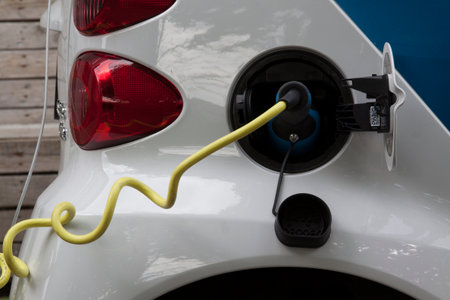 Amsterdam netherlandsmay 8 2015: loading an electric car in the streets of Amsterdamのeditorial素材