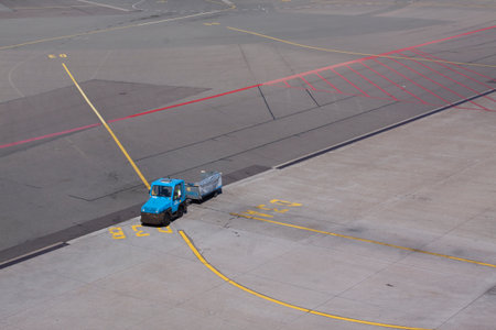 Amsterdamnetherlandsmay 12 2015: Luggage transporter on the platform at Schiphol airport in Amssterdamのeditorial素材
