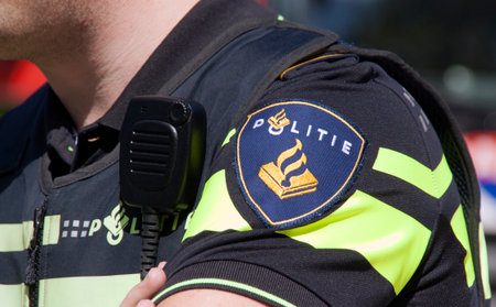 Amsterdamnetherlandsmay 17 2015: Dutch police badge and radio walkie talkieのeditorial素材