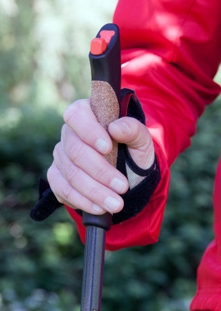 the haguenetherlandsmay 17 2015: Hand holding a NordiQ walking pole in upright positionのeditorial素材