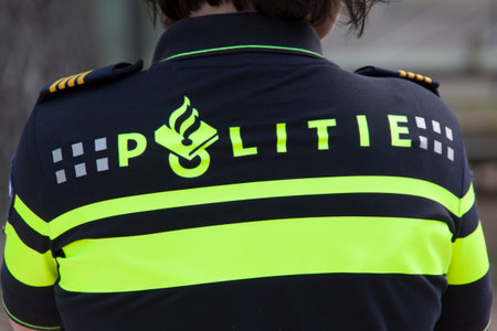 Amsterdamnetherlandsmay 17 2015: invigilate police officer on duty in the streets of Amsterdamのeditorial素材