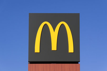 Amsterdam,Netherlands-august 7, 2015: mcDonald sign high in the air so people can see from a distance where the restaurant is located in Amsterdamのeditorial素材