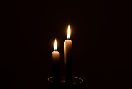 Two candles in the darkの写真素材