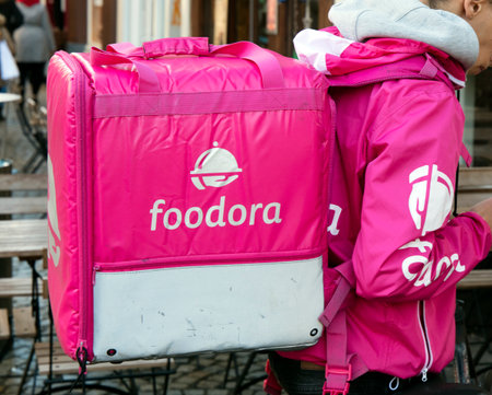 Amsterdam, Netherlands -december 17, 2017: Foodora courier with backpack in Asterdamのeditorial素材