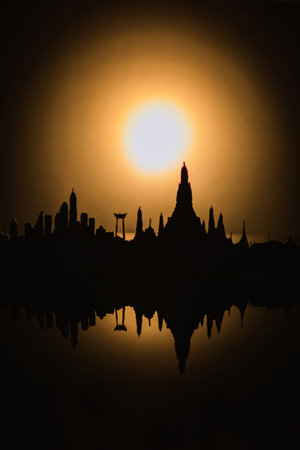Sunset silhouette temple with water reflectionの写真素材