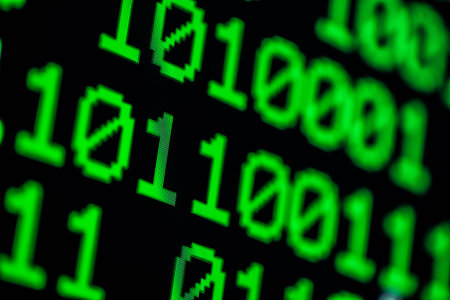 Technology background, close up on texture digital pixel is running prinary code number with black background and selective focus.の写真素材