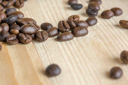 coffee beans on wooden background with effect filter and selective focus.の写真素材