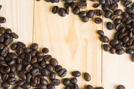 coffee beans on wooden background with effect filter.の写真素材