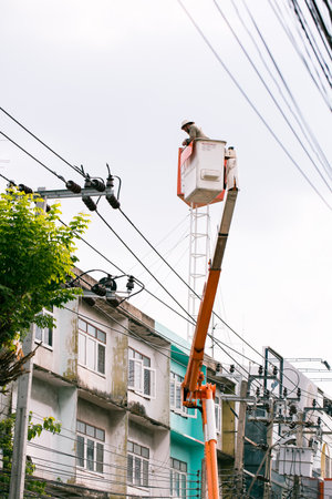 Technician is checking safety electric cable rope on crane.の写真素材