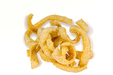 snack Thai food, fried pork crackling It's pork rind and fat isolated on white background, include with path filed.の写真素材