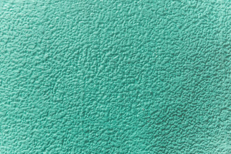 Green texture, close up on rough texture on the wall, abstract background.の写真素材