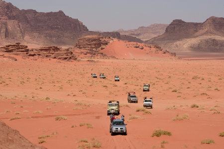 safari group approaching in 4x4 vehicles in Wadi Rum, Jordanのeditorial素材