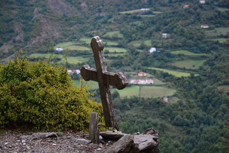 desolate cross high above the valley