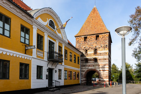 street in Stege at Moen Island with the local museum and the historic mill with the city gate
