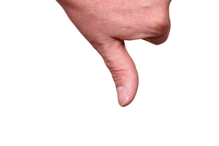Thumb down isolated on a white backgroundの写真素材
