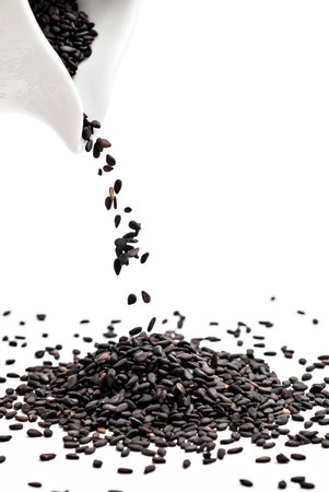 Black sesame falling from the jugの写真素材