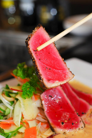 Seared Tuna with chopsticksの写真素材