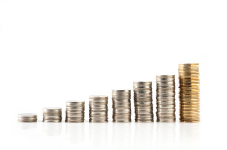 increasing Silver and gold Thai baht coins charts isolated on white background の写真素材