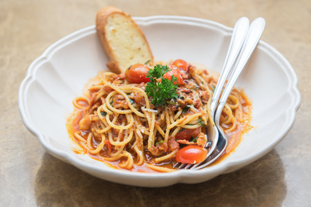 spaghetti tomato sauce with bacon anf dried chiliの写真素材