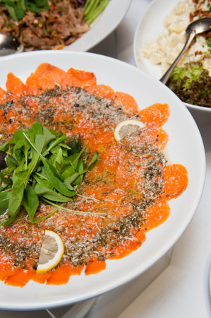 Organic Smoked Salmon Sliced with rocket saladの写真素材