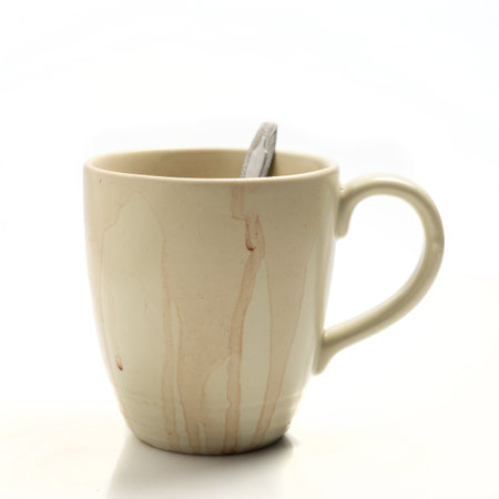 Used coffee cup isolated on white backgroundの写真素材