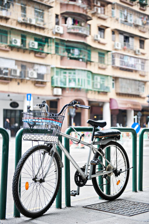 Bicycle was locks on footpath in Hongkongの写真素材