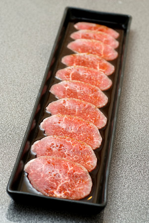 Premium raw japanese beef sliced on plateの写真素材