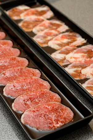 Premium raw japanese beef sliced on plateの写真素材