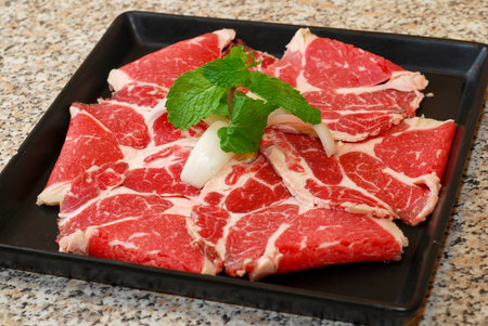 Premium raw japanese beef sliced on plateの写真素材