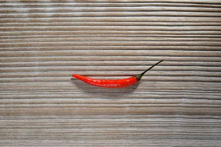 Red Chilli on wooden textureの写真素材