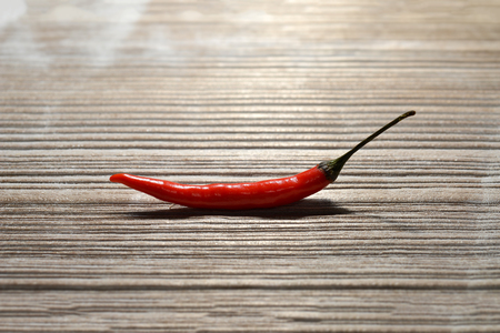Red Chilli on wooden textureの写真素材