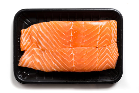 Fresh Salmon slices isolated on white backgroundの写真素材