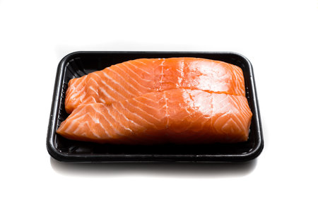 Fresh Salmon slices isolated on white backgroundの写真素材