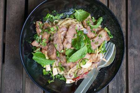 grilled pork neck with thai spices sauceの写真素材