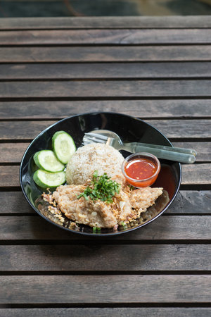 fried pork with fried rice and garlic の写真素材