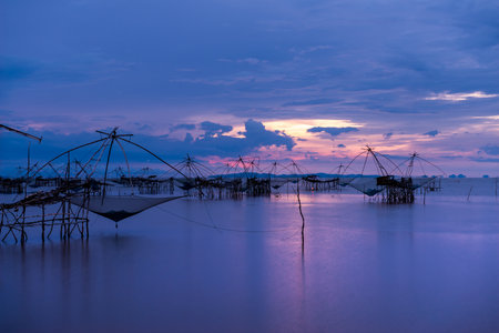 traditional local fisherman used net fishing in Pakpra Thale Noi, one of the country's largest wetlands covering Phatthalung, Nakhon Si Thammarat and Songkhla ,South of THAILAND.の写真素材