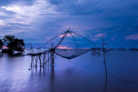 traditional local fisherman used net fishing in Pakpra Thale Noi, one of the country's largest wetlands covering Phatthalung, Nakhon Si Thammarat and Songkhla ,South of THAILAND.の写真素材