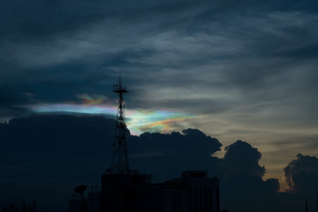 Silhouette of cellular tower with beautiful sunset cloudy skyの写真素材