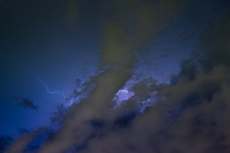 Stroke of lightning with storm clouds