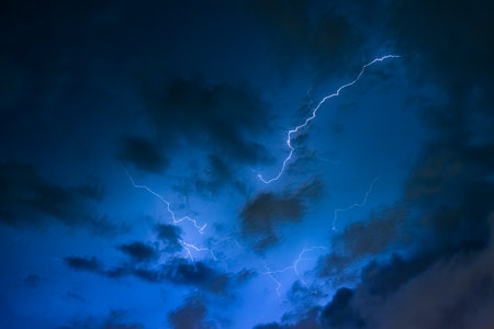 Stroke of lightning with storm cloudsの写真素材