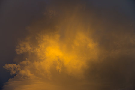 storm clouds with beautiful sunset lightの写真素材