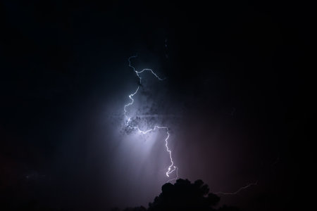 Stroke of lightning with storm clouds